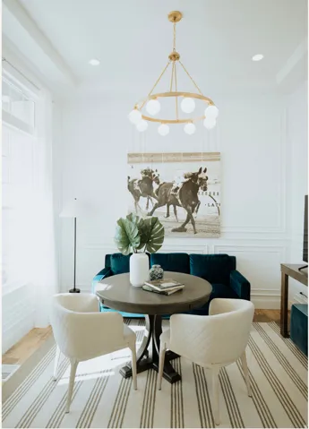 Dining room with wood finished floors, a decorative wall, recessed lighting, and a chandelier