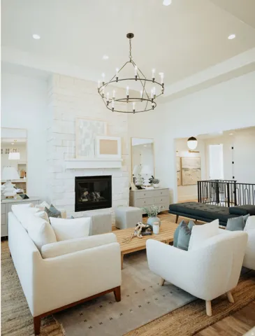 Living area with a chandelier, recessed lighting, a fireplace, and wood finished floors