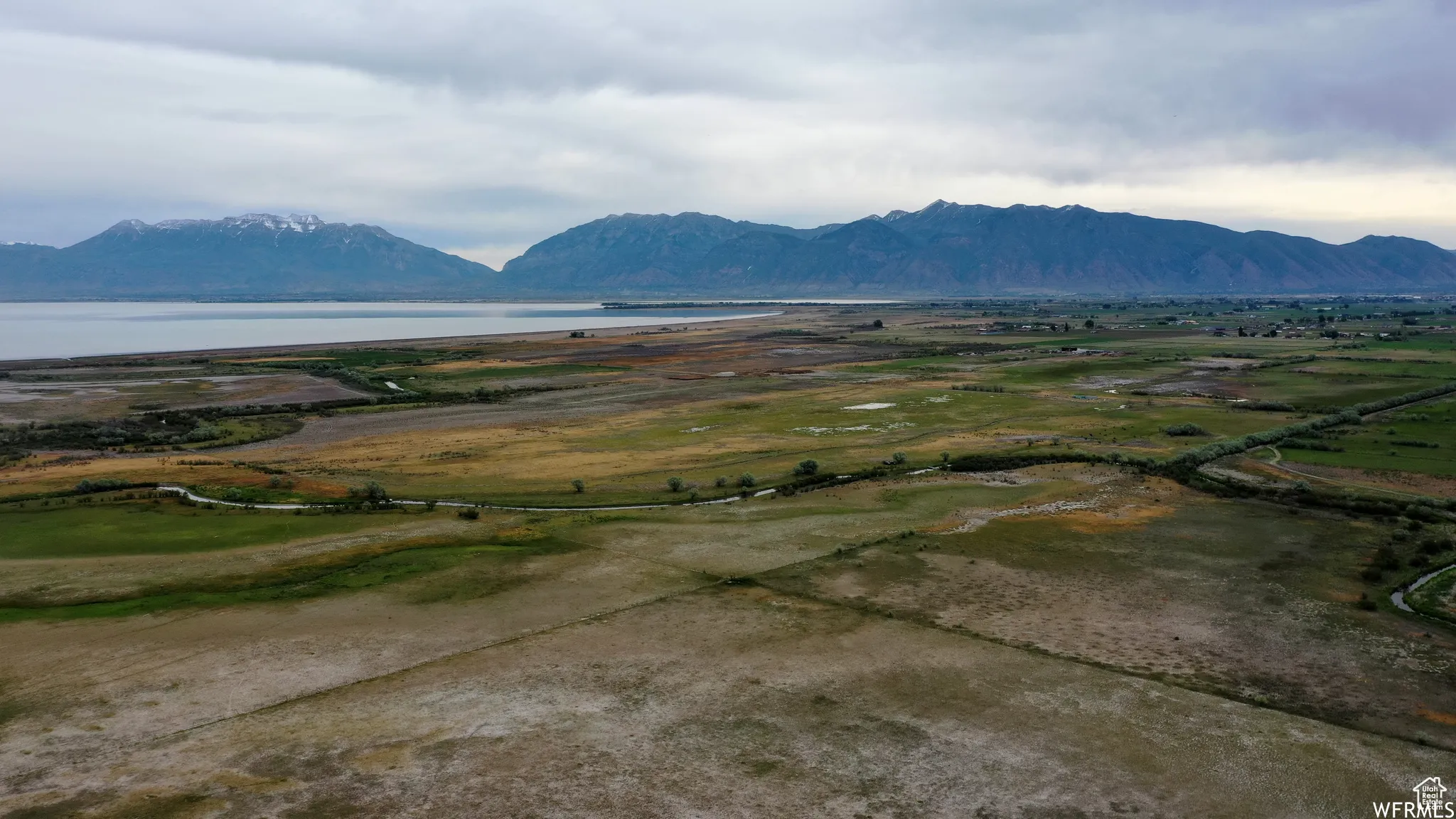 Property view of mountains featuring a water view