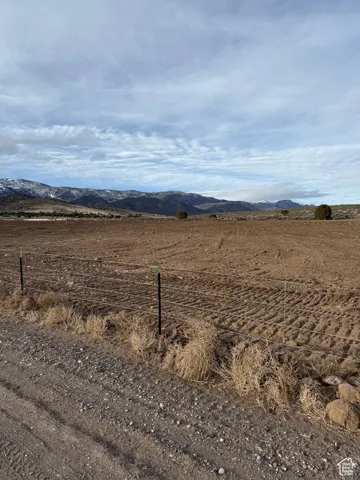 Property view of mountains with a rural view