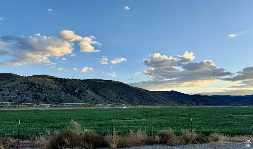 Property view of mountains with a rural view