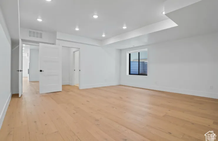 Spare room featuring light hardwood / wood-style flooring