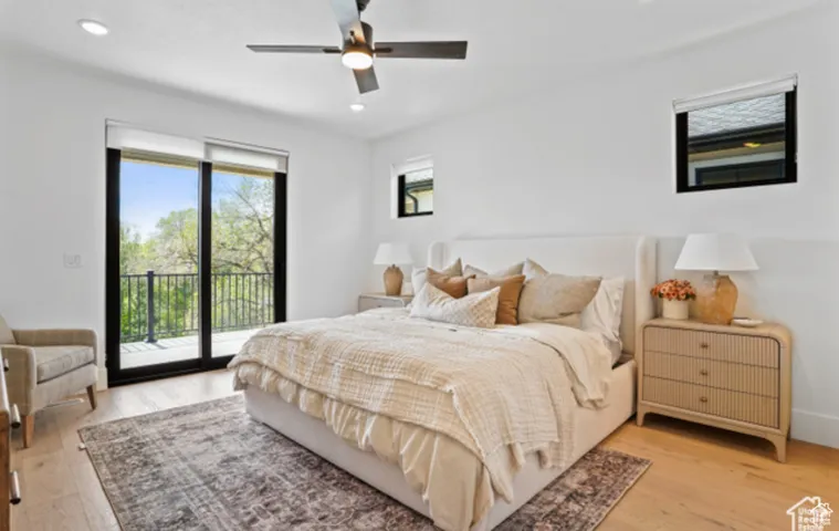 Bedroom featuring access to exterior, ceiling fan, and light wood-type flooring