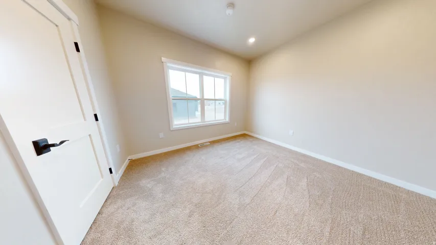 Unfurnished room with carpet and recessed lighting