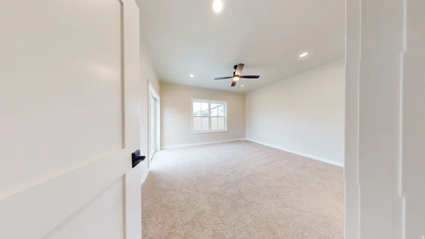 Spare room with light colored carpet, recessed lighting, and ceiling fan