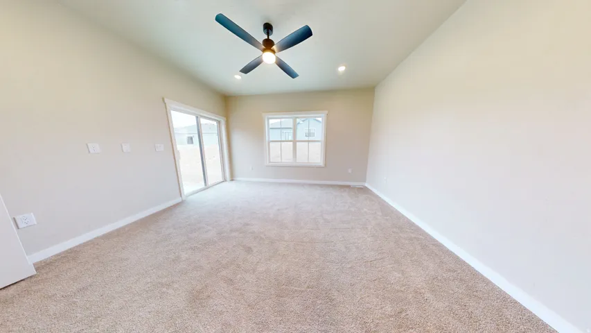 Unfurnished room with light carpet, a ceiling fan, and recessed lighting