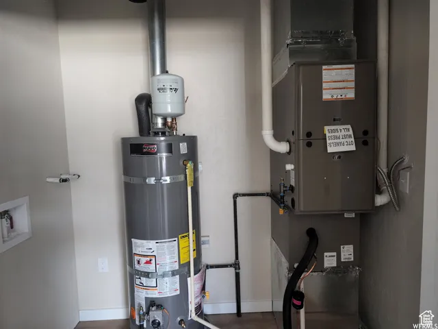 Utilities with strapped water heater