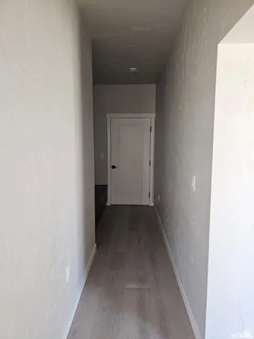 Hall with wood-type flooring