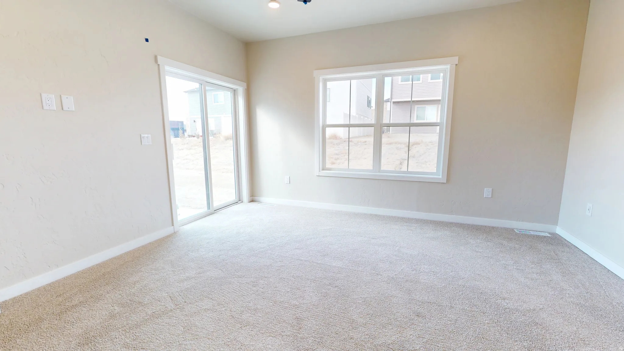Unfurnished room with carpet floors and baseboards