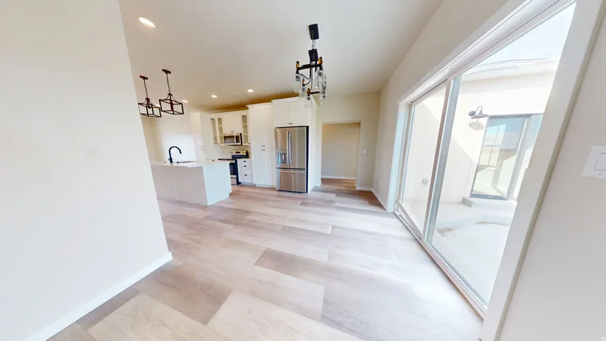Hall featuring recessed lighting and light wood-style flooring