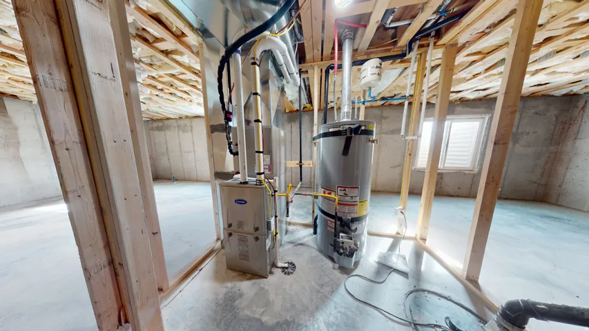 Basement featuring water heater and heating unit