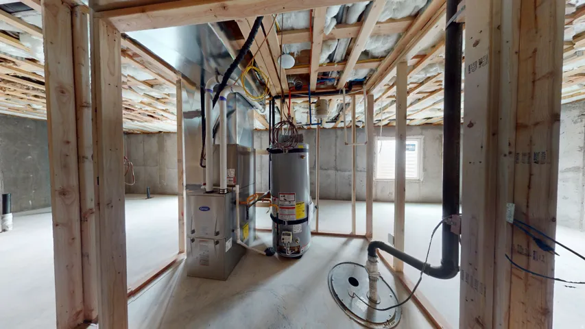 Basement featuring gas water heater and heating unit