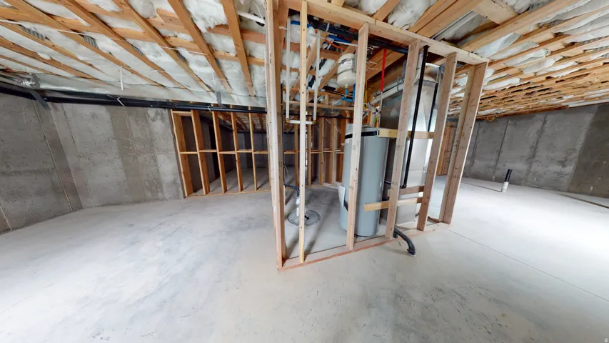 Unfinished basement featuring gas water heater
