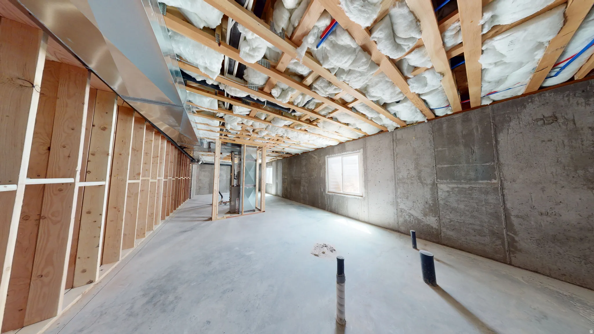 Below grade area featuring heating unit