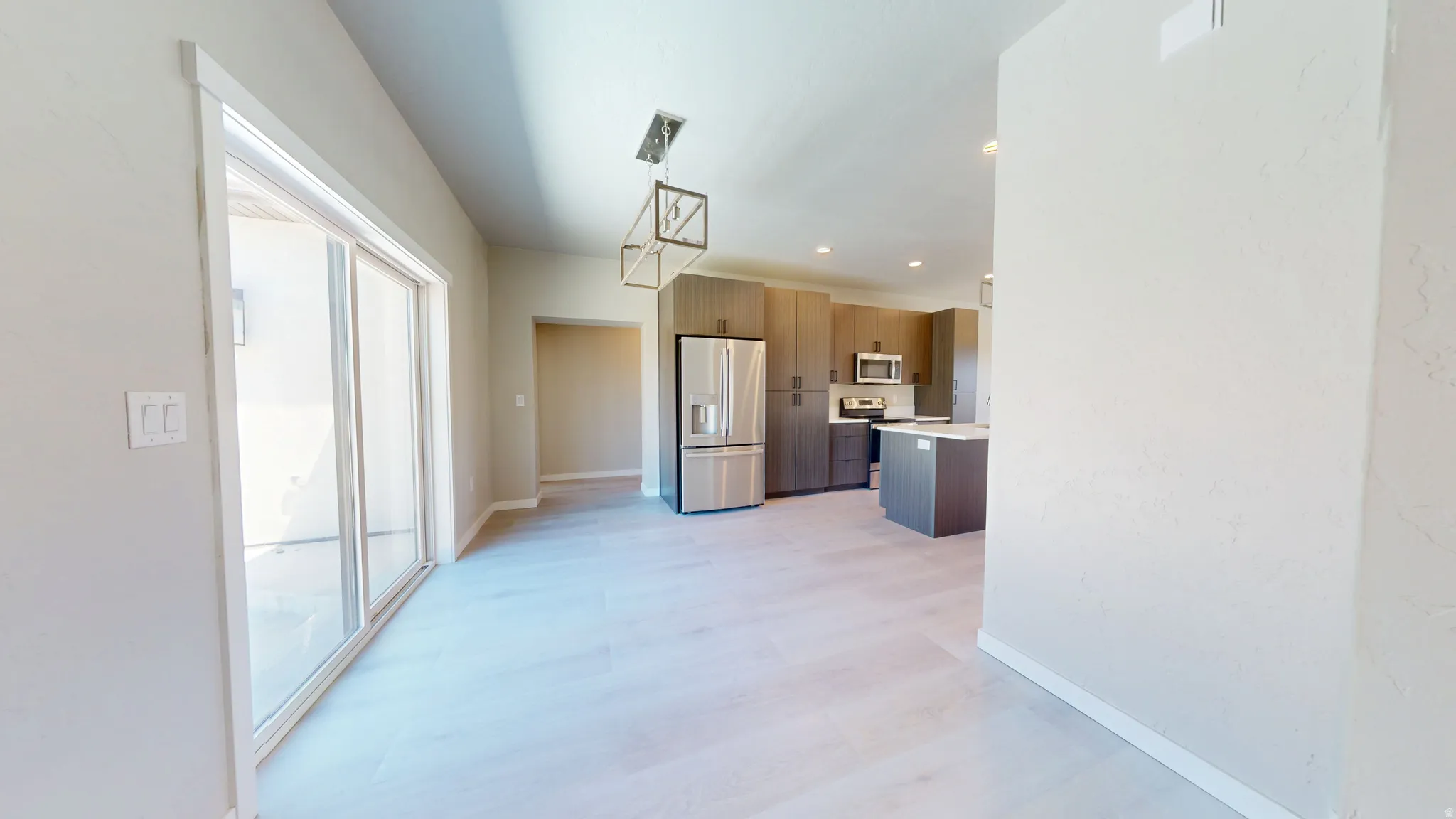Unfurnished dining area featuring recessed lighting and light wood-type flooring