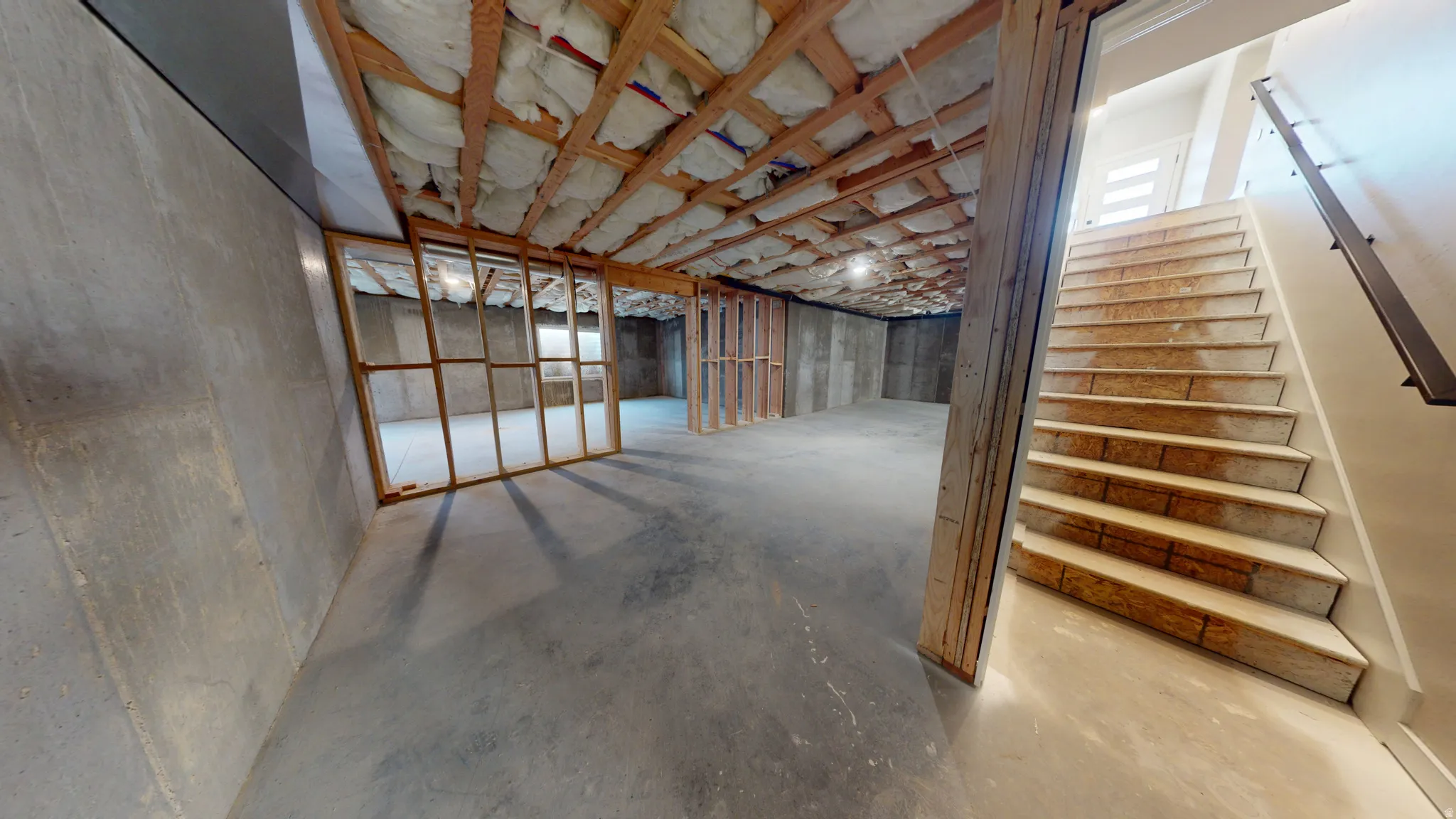 Below grade area featuring stairs