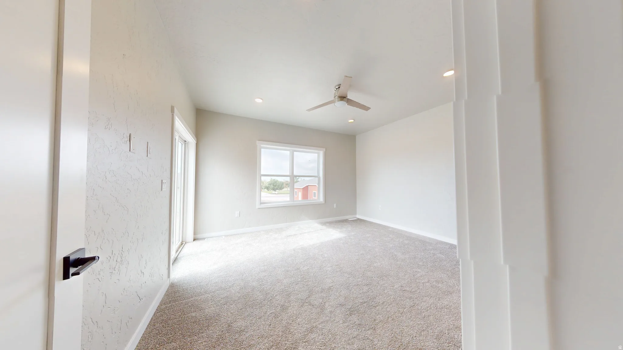 Unfurnished room featuring carpet floors, ceiling fan, and recessed lighting