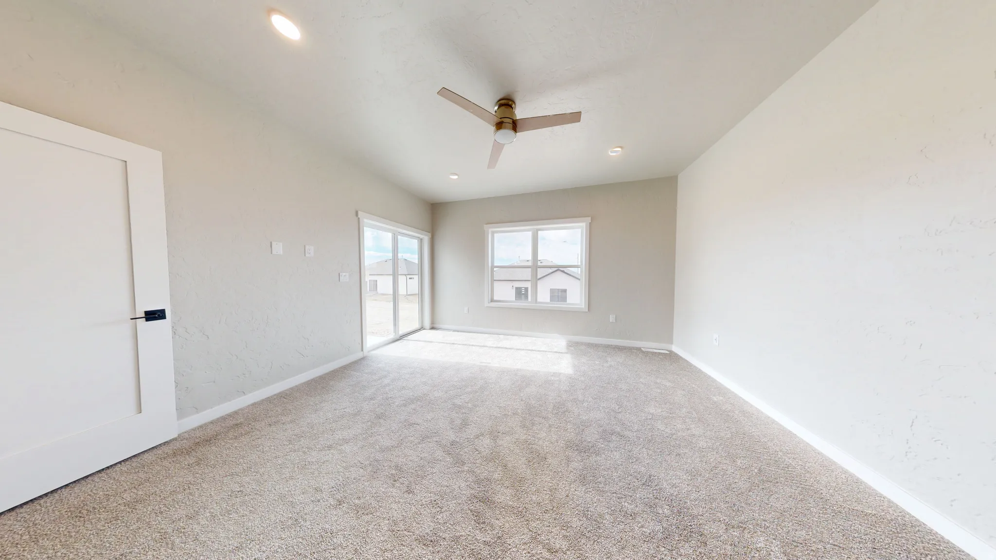 Unfurnished bedroom with access to exterior, light carpet, a ceiling fan, and recessed lighting