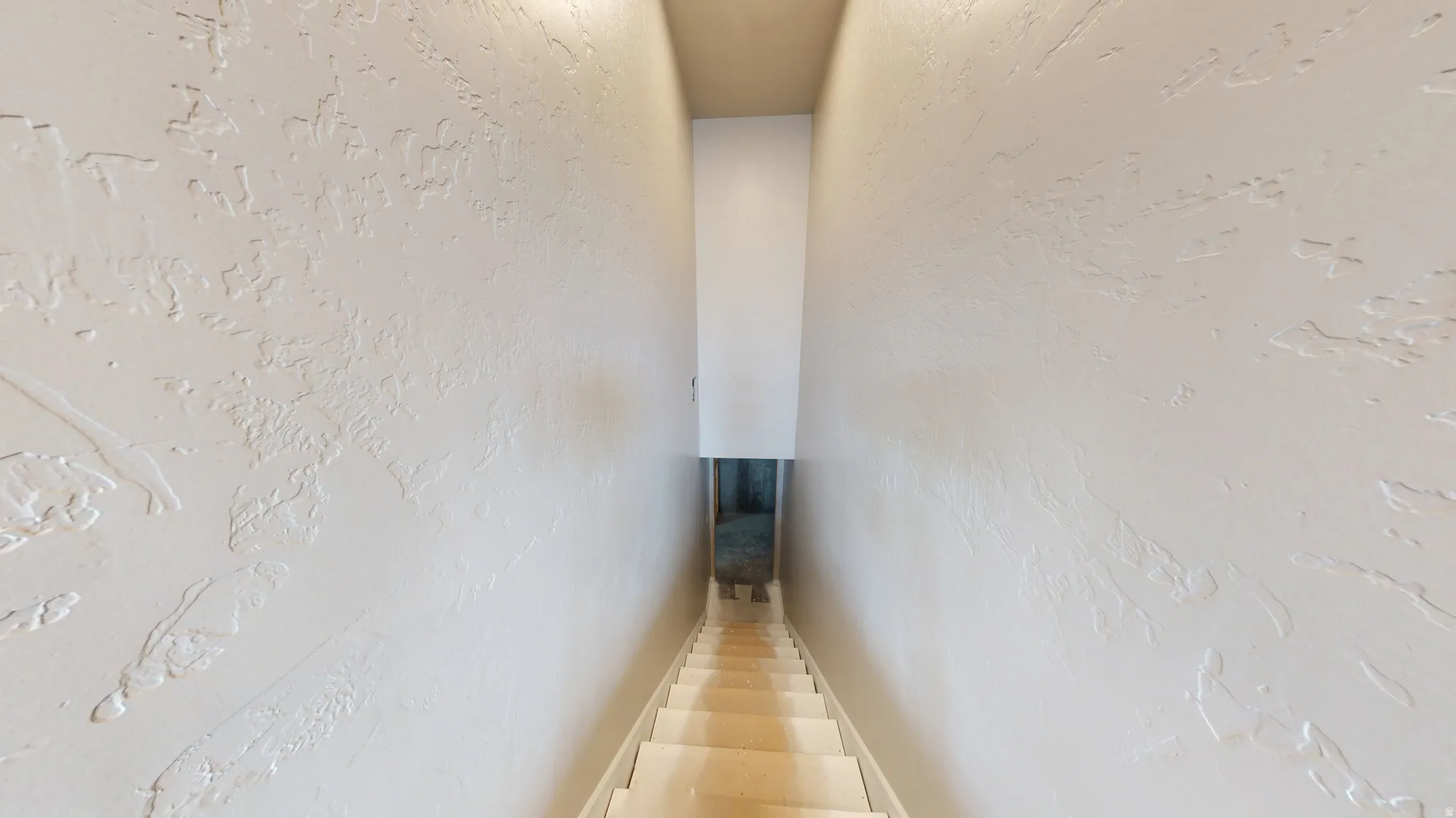 Stairs with a textured wall