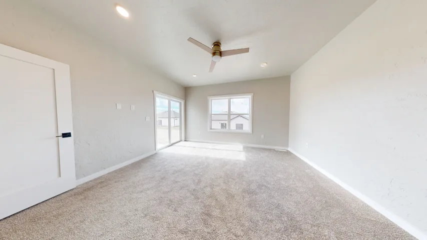 Unfurnished bedroom with access to exterior, light carpet, a ceiling fan, and recessed lighting