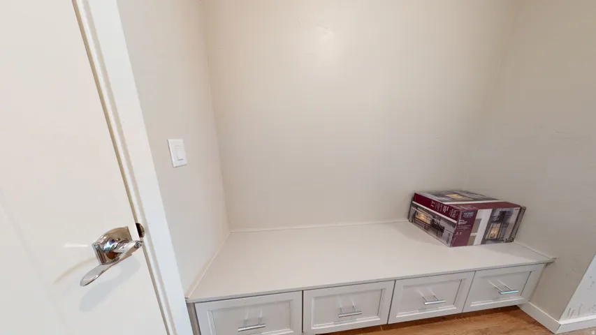 Detailed view of wood finished floors and baseboards
