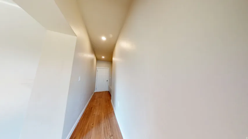 Hall featuring recessed lighting and light wood-style floors