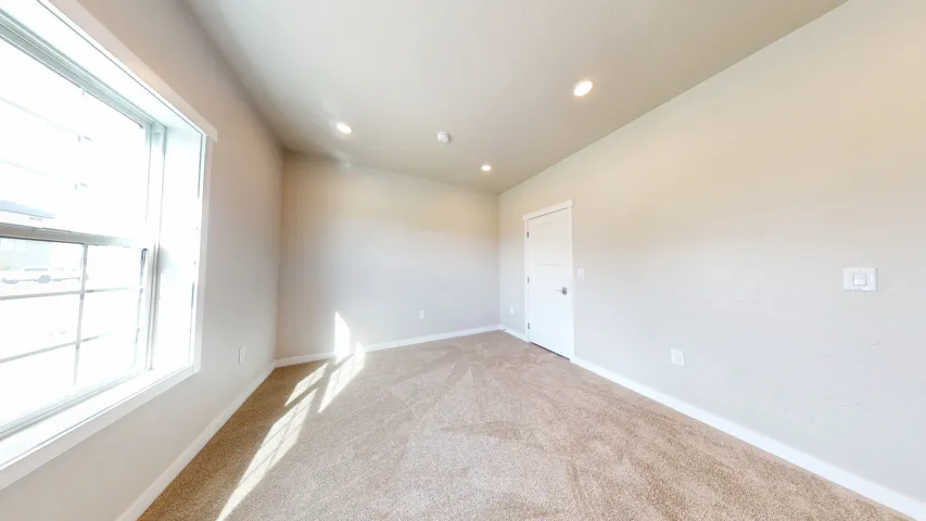Empty room featuring carpet floors and recessed lighting