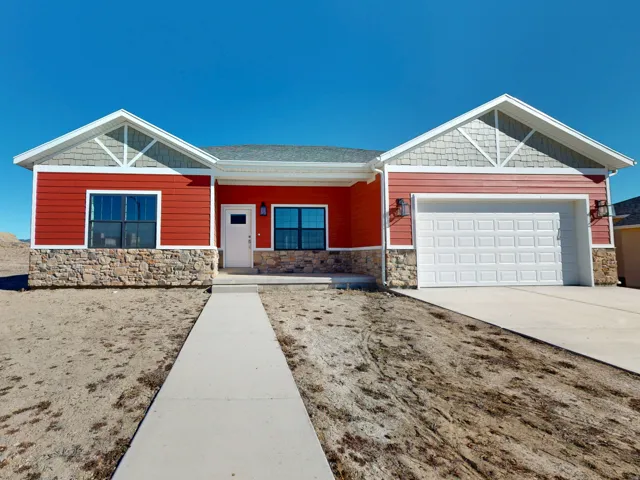 Craftsman-style home featuring covered porch, concrete driveway, a garage, and stone siding