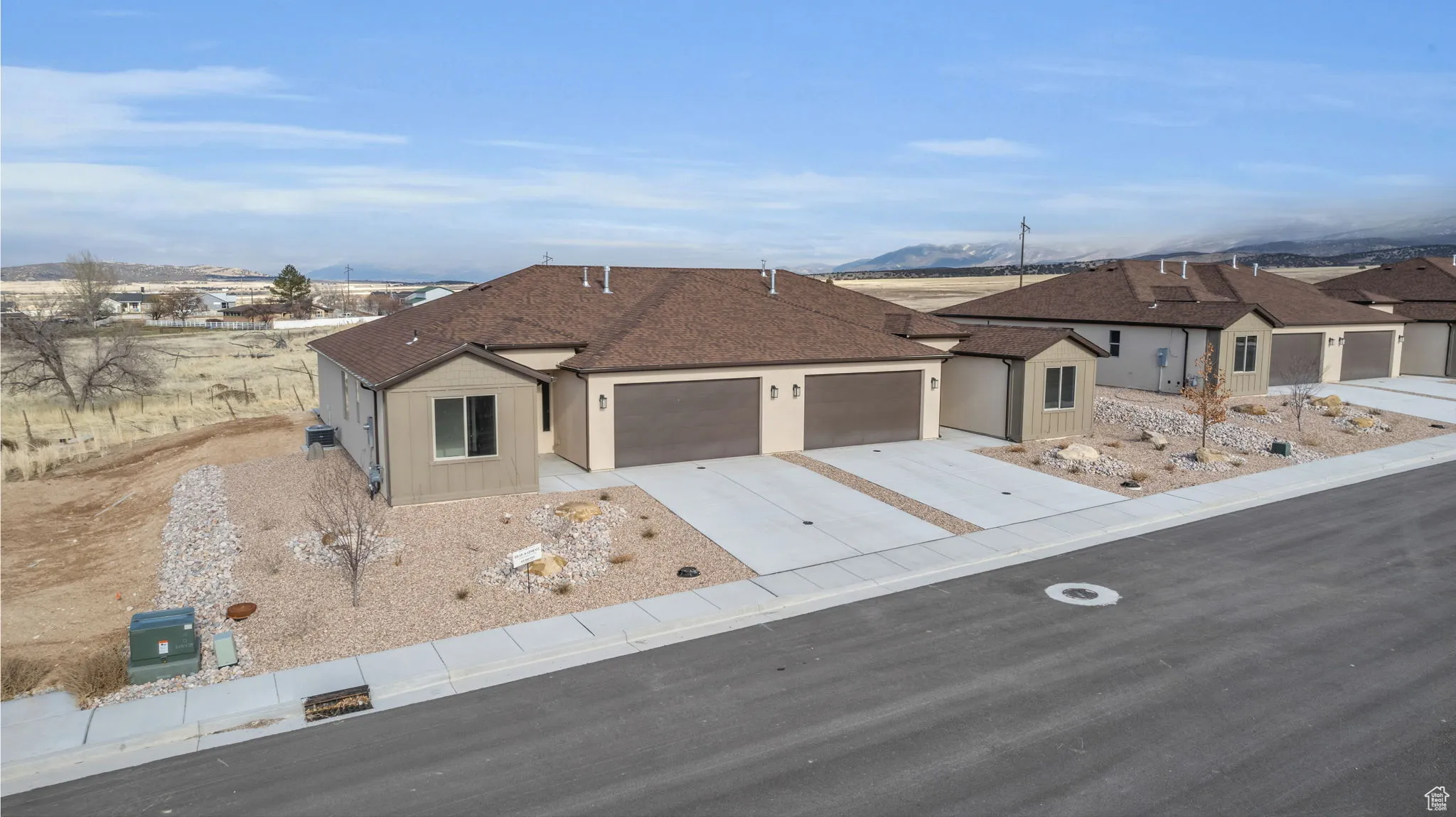 Ranch-style house featuring a mountain view and a garage