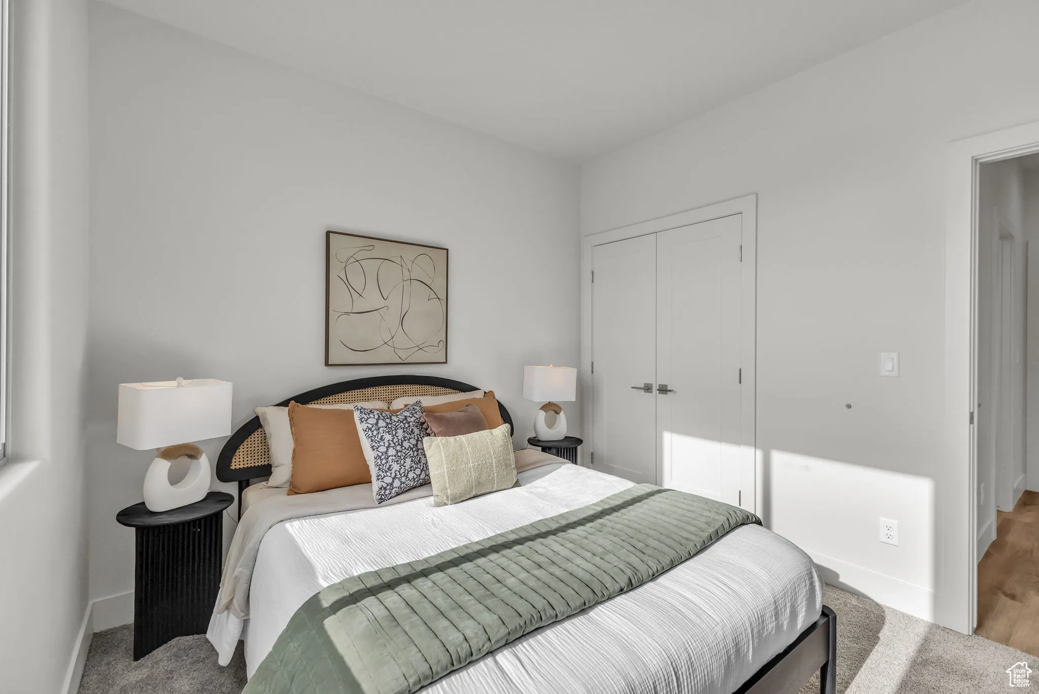 Carpeted bedroom featuring a closet