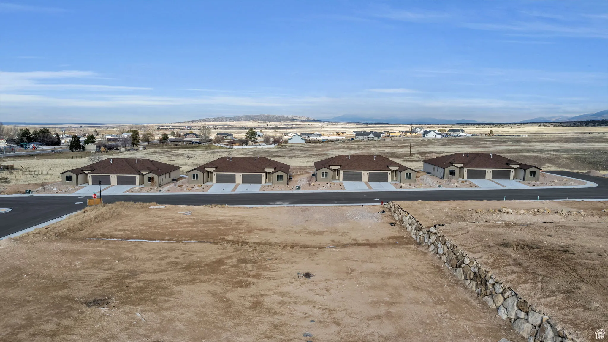 Birds eye view of property with a mountain view