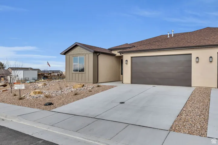 Single story home featuring a garage