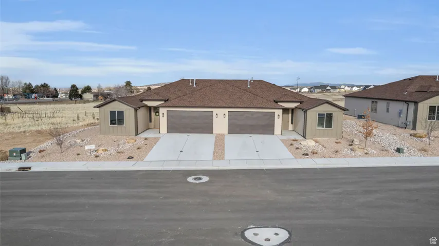 Ranch-style home featuring a garage