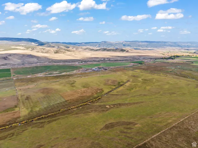 Birds eye view of property featuring a mountain view and a rural view