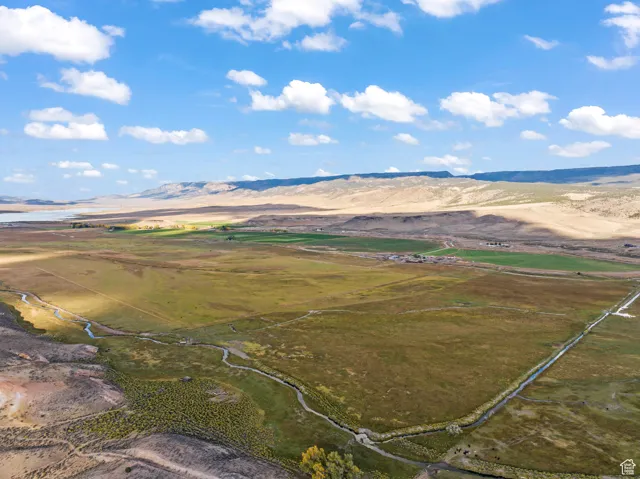 Birds eye view of property with a mountain view and a rural view