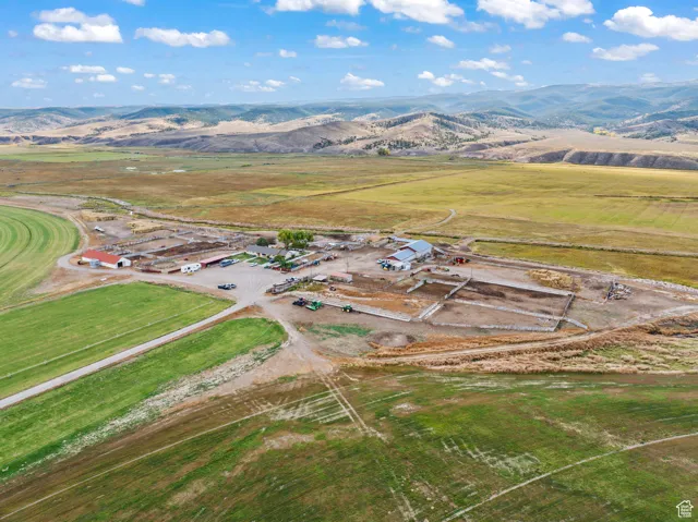 Drone / aerial view with a mountain view and a rural view