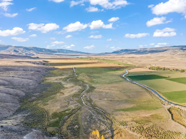 Birds eye view of property featuring a mountain view and a rural view