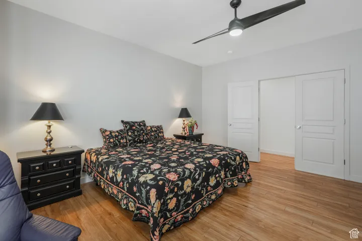 Bedroom featuring a closet, ceiling fan, and light hardwood / wood-style flooring