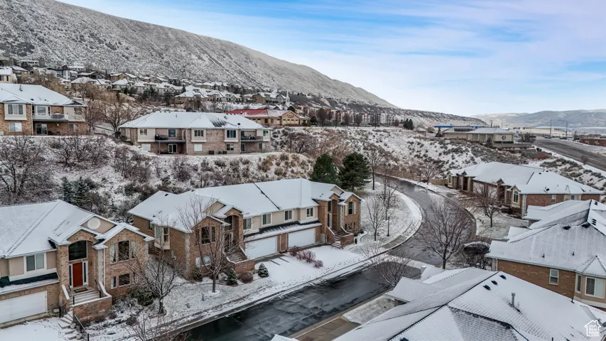 Snowy aerial view with a mountain view