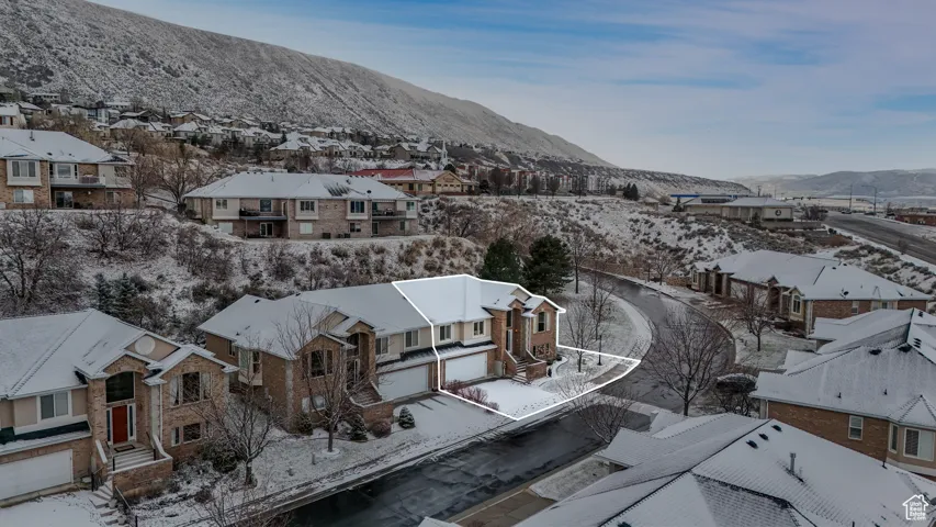 Snowy aerial view with a mountain view