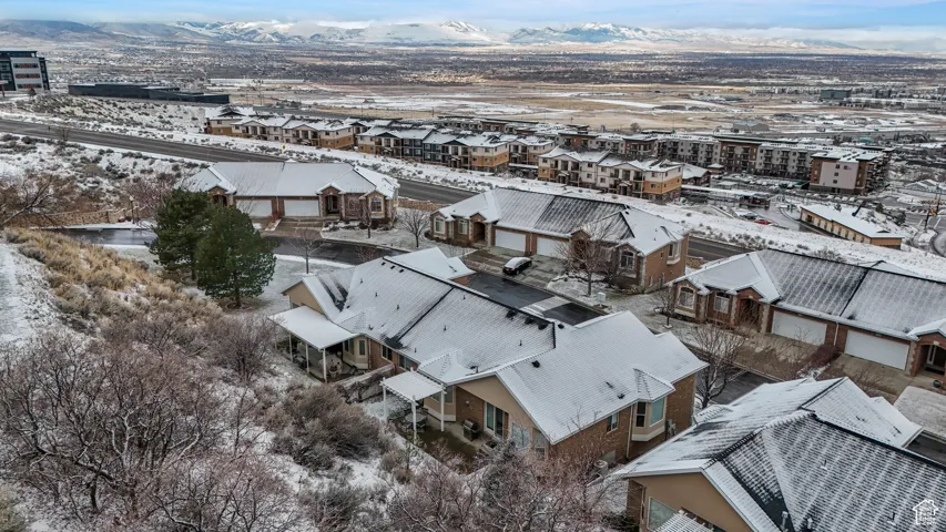Snowy aerial view featuring a mountain view