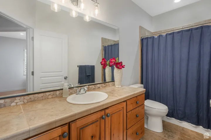 Bathroom featuring vanity and toilet