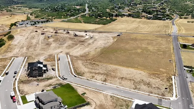 Expansive land parcel with surrounding paved roads and established infrastructure