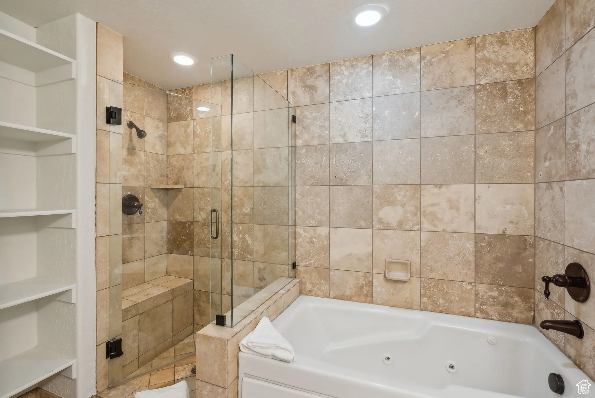 Bathroom with built in features and shower with separate bathtub