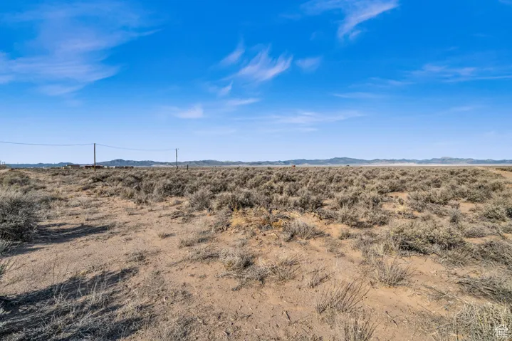 Property view of mountains with a rural view