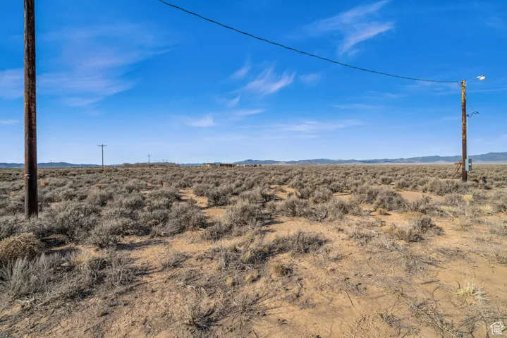 Property view of mountains with a rural view