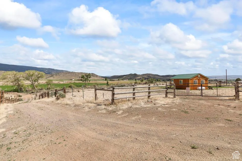 View of yard featuring a view of rural / pastoral area and a mountain view