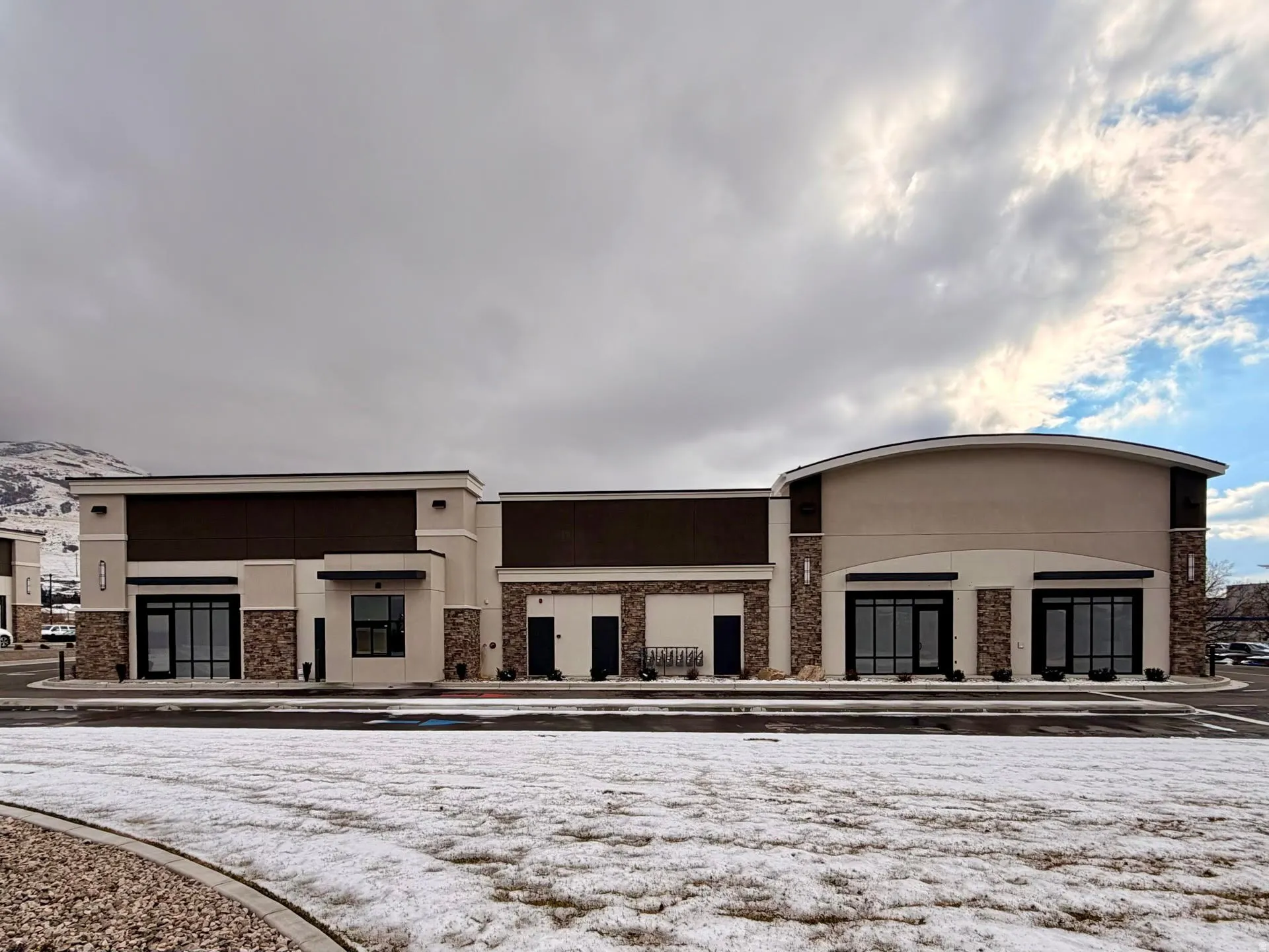 View of front of home with stone siding and stucco siding