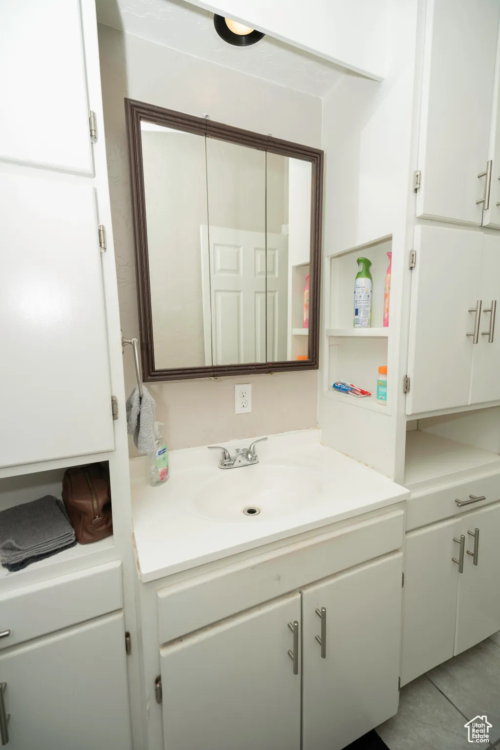 Bathroom with vanity and tile patterned flooring