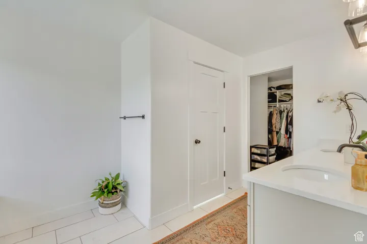 Bathroom featuring vanity and tile patterned flooring